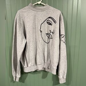 Gray Sweatshirt with Abstract Face Design